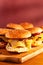 Burgers on a wooden tray with place for a headline. Stock photo