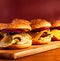 Burgers on a wooden tray with place for a headline. Stock photo