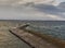 Burghead\'s Pier in an extreme high tide.