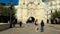 Burgos, Spain - October 18, 2022. Tourists walking through the arch of Santa Maria and medieval bridge in Burgos, Spain