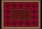 Burgundy carpet with ethnic ornaments with patterns of crimson flowers on the border and orange brown frame the edges