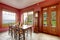 Burgundy dining room with antique clock