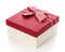 Burgundy gift box with a beautiful bow on a white background