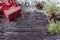Burgundy gift box close-up on dark new year background