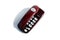 Burgundy landline phone stands on a white background