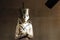 Burial figurine of pharaoh Tutenkhamun with egyptian symbols of authority. Close up view.