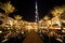 Burj Dubai, night Dubai street with palms and pool