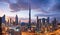 Burj Khalifa skyline in Dubai at dramatic sunset - aerial view, United Arab Emirates