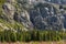 Burkhan bulak waterfall, the highest waterfall in Kazakhstan. Waterfall with strong stream is flowing among rocky mountains. Outdo