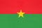 Burkina faso national fabric flag, textile background. Symbol of world african country