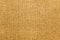 Burlap background toned in honey dijon color