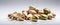 Burlap Harmony Rustic Pistachios Arranged on White Table in Dim Light