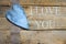 Burlap ribbon and heart on wooden table, i love you