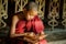 BURMA Little monk or Novice monk are reading the book in the temple of Buddhism Religion in Mandalay Myanmar.