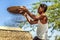 Burmese farmer sifts grains