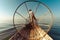 Burmese fisherman on bamboo boat catching fish. Inle lake, Myanmar (Burma)