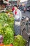 Burmese girl shops for vegetables