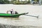 Burmese man handling homemade motor boat in river 3