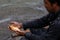 Burmese man holding freshwater fish