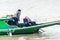 Burmese man starting the engine of homemade motor boat 2