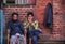 Burmese men sitting at old brick house