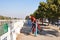 Burmese monk old men playing exercise on equipment playground beside road of water moat canal of Mandalay Palace on February 3,