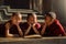 Burmese novices or three priests are reading happily in the classroom. Counting the development of education in Mandalay Myanmar