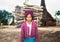 Burmese woman carrying a bundle of heavy wood in Indein village