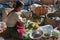 Burmese woman cut vegetables on asian open market