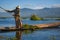 Burmese woman harvest aquatic plant in Inle lake