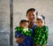 Burmese woman with two boys at countryside