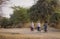 Burmese women biking on rural road in Bagan, Myanmar