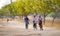 Burmese women biking on street in Bagan, Myanmar