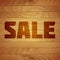 Burn Sale Tag on Wood Texture