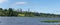 Burnaby, British Columbia, Canada skyline from Deer Lake looking towards Metrotown and apartment complexes on a sunny summer day