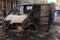 Burned car in the center of city after unrest