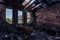 Burned interiors after fire in industrial or office building. Burnt furniture