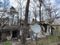 A burned-out private house from an artillery shell hit. Destroyed house from a mine. Housing damaged as a result of military