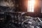 Burned room interior in apartment house. Burned furniture and charred walls in black soot