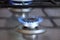 The burner of the gas stove close-up cooking bright flame of natural gas