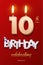 Burning Birthday candle in the form of number 10 figure and Happy Birthday celebrating text with party cane isolated on
