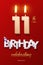 Burning Birthday candles in the form of number 11 figure and Happy Birthday celebrating text with party cane isolated on