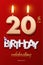 Burning Birthday candles in the form of number 20 figure and Happy Birthday celebrating text with party cane isolated on