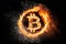 Burning Bitcoin on black background.