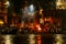 The burning bodies ceremony at holy Dasaswamedh Ghat, near Kashi Vishwanath Temple while raining at night, Varanasi, India