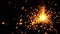 Burning bright orange sparkler against black background 4K video