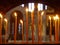 Burning candle on the background of Holy Cathedral of Agia Triada in Piraeus, Greece.