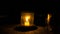 Burning candle in a glass jar on the table