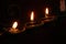 Burning candles as an offering in a place of worship