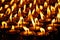 Burning candles in Buddhist temple. Dharamsala, Himachal Pradesh